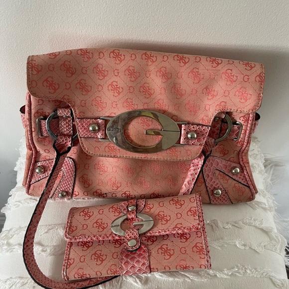 Guess Handbags - Pink/Peachy Guess purse with matching wallet.